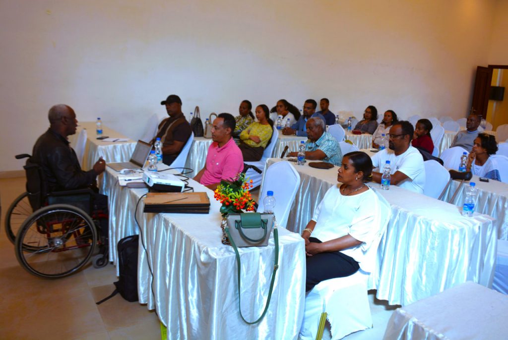 Workshop audience including a participant using a wheelchair.