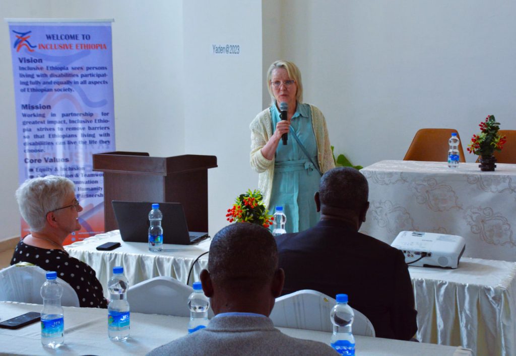 Speaker presents at a project-launch workshop.